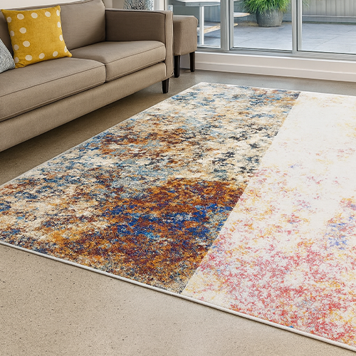 Vibrant abstract rug design restored from fading in a modern living room